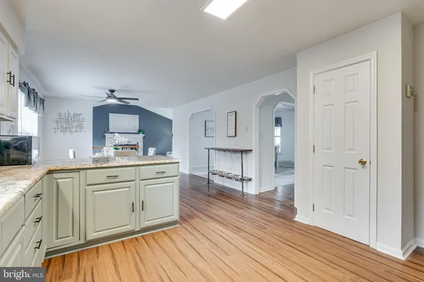a kitchen with stainless steel appliances a microwave a stove a sink dishwasher and a refrigerator