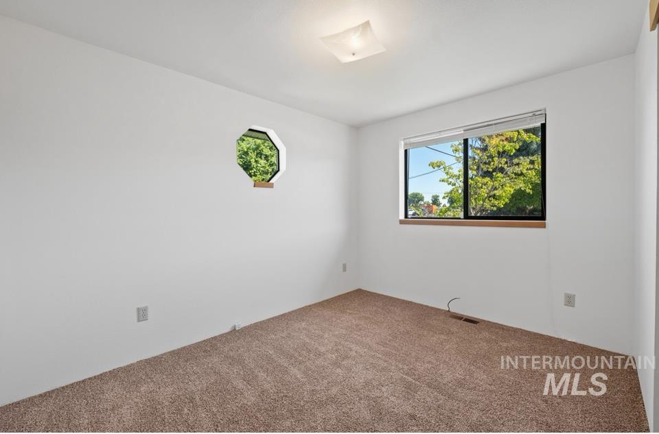 1128 Burrell Avenue, Unit 2 Lewiston, ID 83501 - Photo 16 of 24 View of carpeted empty room