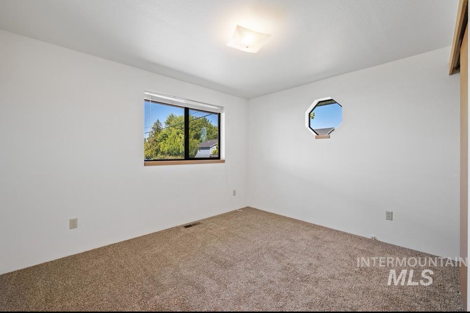 1128 Burrell Avenue, Unit 2 Lewiston, ID 83501 - Photo 17 of 24 Unfurnished room featuring carpet