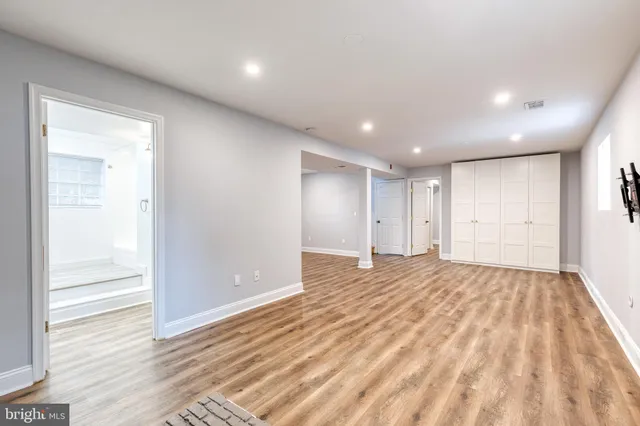 a view of an empty room and wooden floor