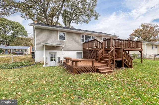 a view of a backyard with a garden and entertaining space