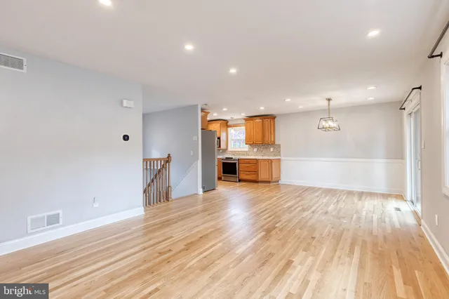 a view of a kitchen with a sink and a stove top oven