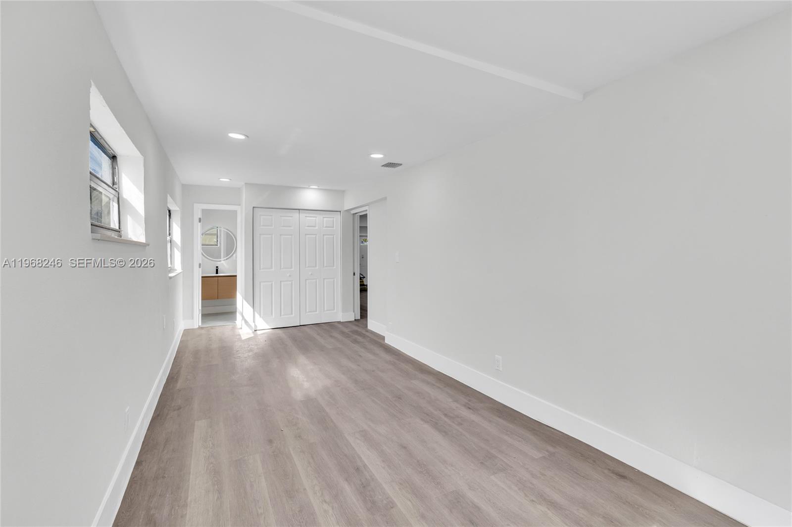 2330 Rutland Street Opa-Locka, FL 33054 - Photo 11 of 29 a view of an empty room with wooden floor