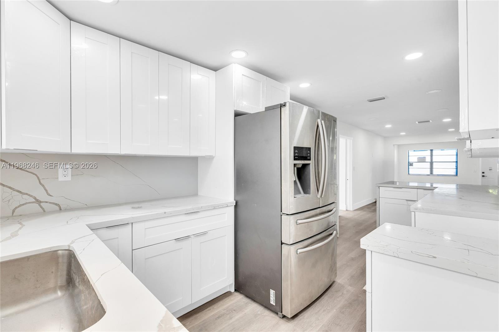 2330 Rutland Street Opa-Locka, FL 33054 - Photo 20 of 29 a kitchen with stainless steel appliances granite countertop a refrigerator sink and stove