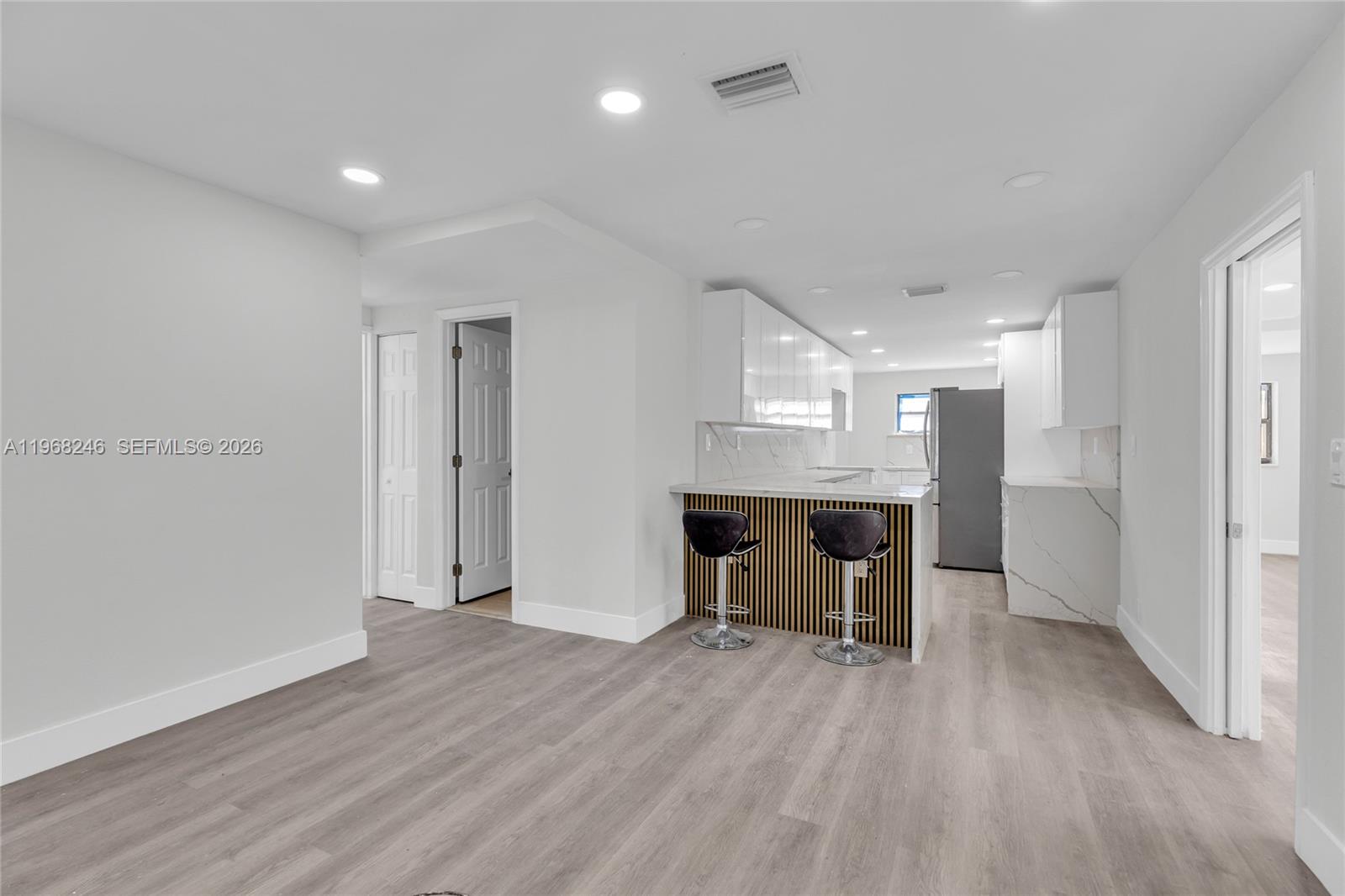 2330 Rutland Street Opa-Locka, FL 33054 - Photo 2 of 29 a view of kitchen with cabinets and wooden floor