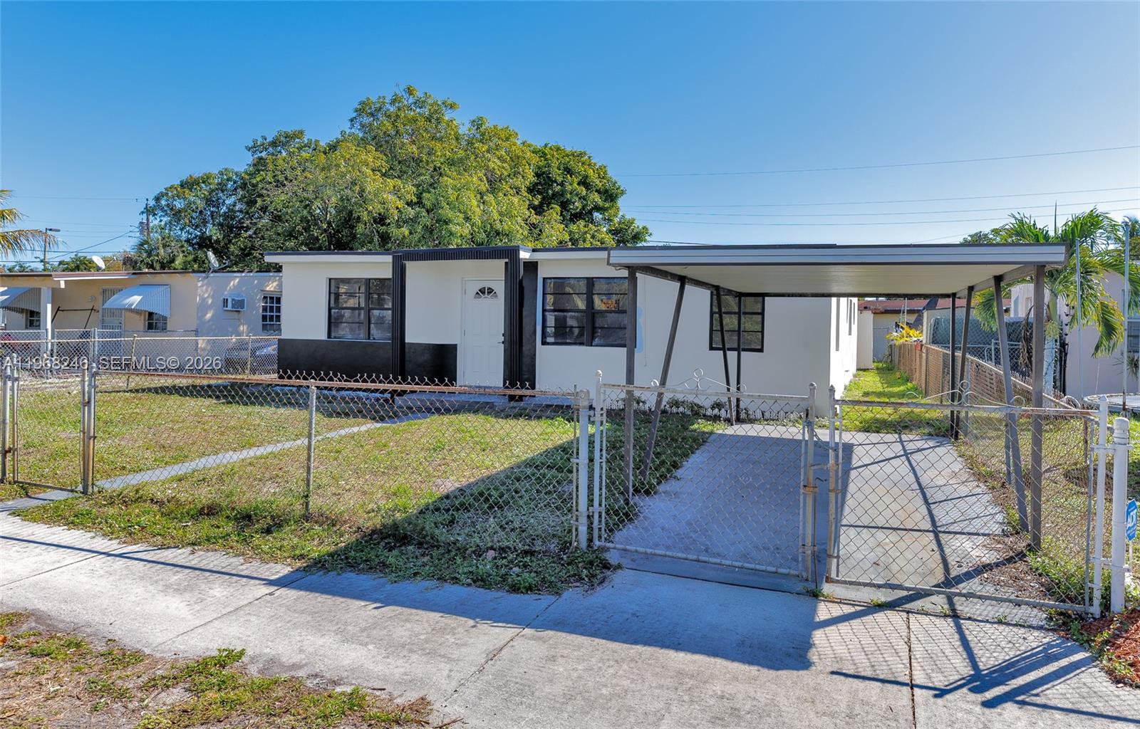 2330 Rutland Street Opa-Locka, FL 33054 - Photo 24 of 29 a view of a house with swimming pool in front of it