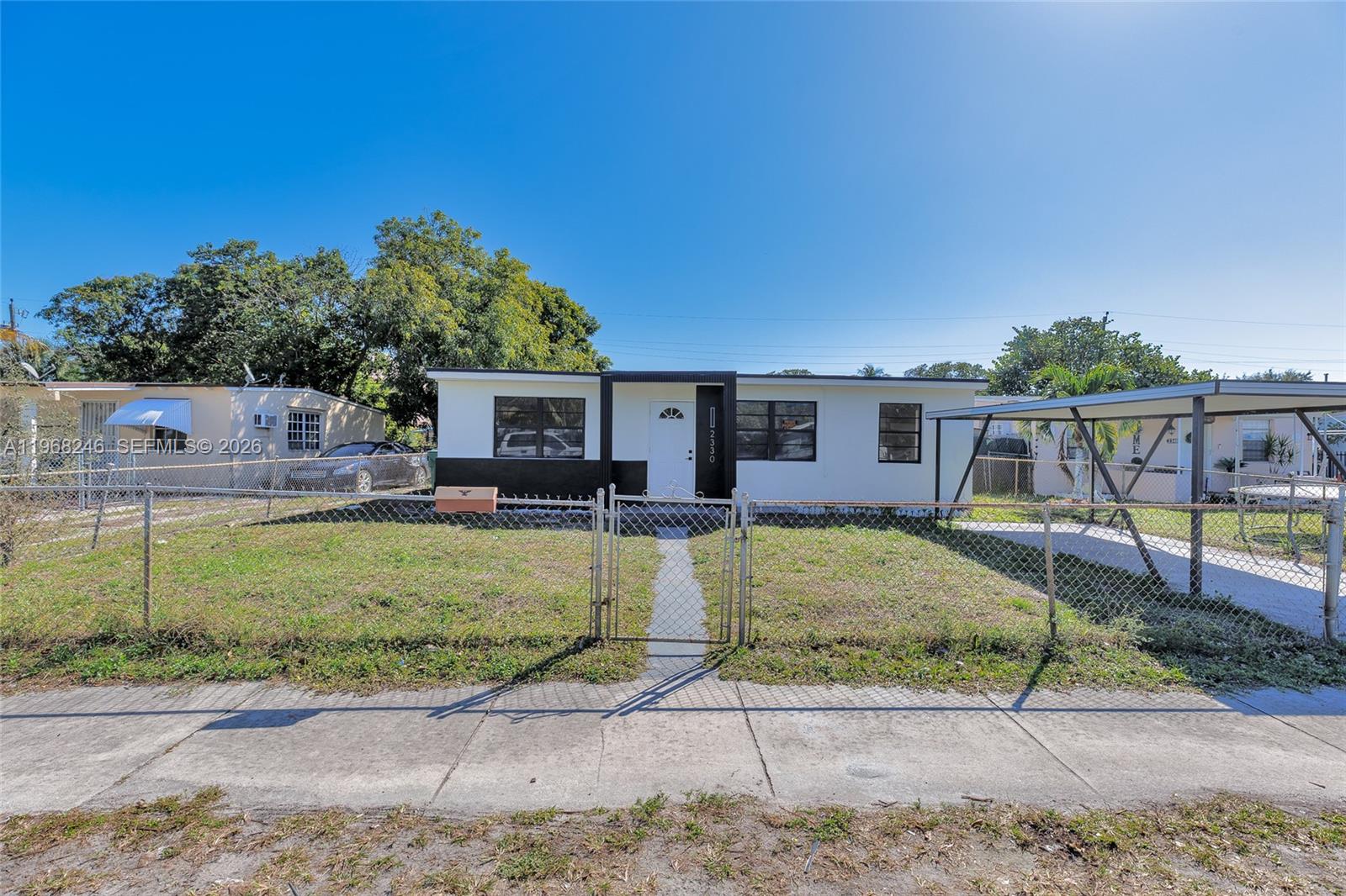 2330 Rutland Street Opa-Locka, FL 33054 - Photo 25 of 29 a view of a house with a backyard