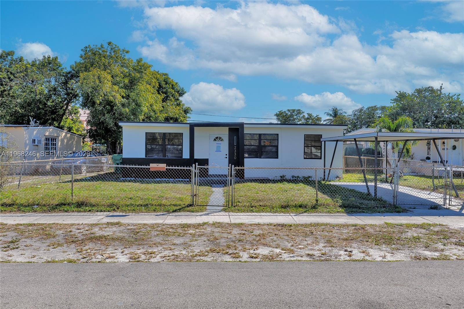 2330 Rutland Street Opa-Locka, FL 33054 - Photo 28 of 29 a view of a house with a backyard