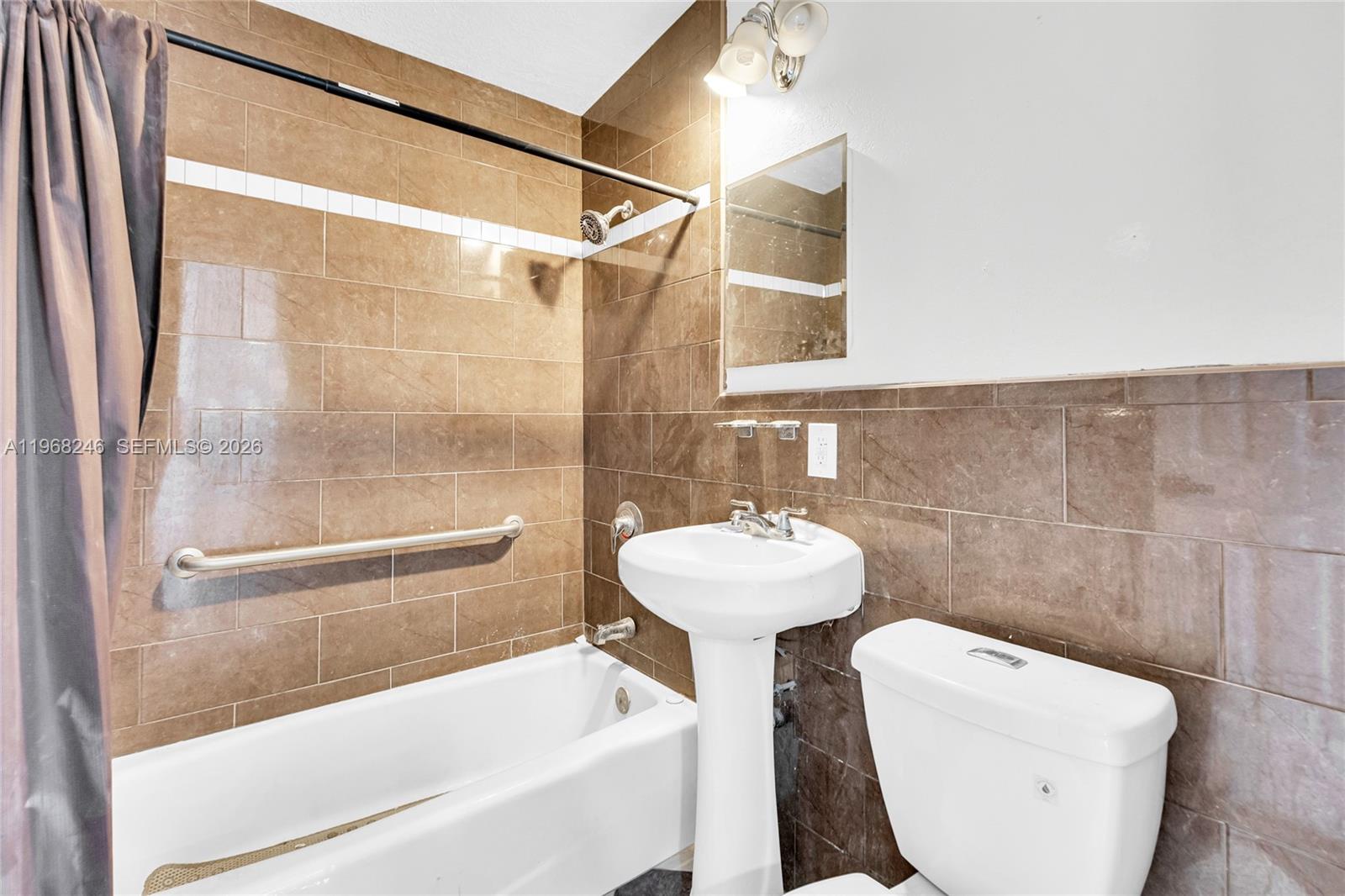 2330 Rutland Street Opa-Locka, FL 33054 - Photo 5 of 29 a bathroom with a sink toilet and shower