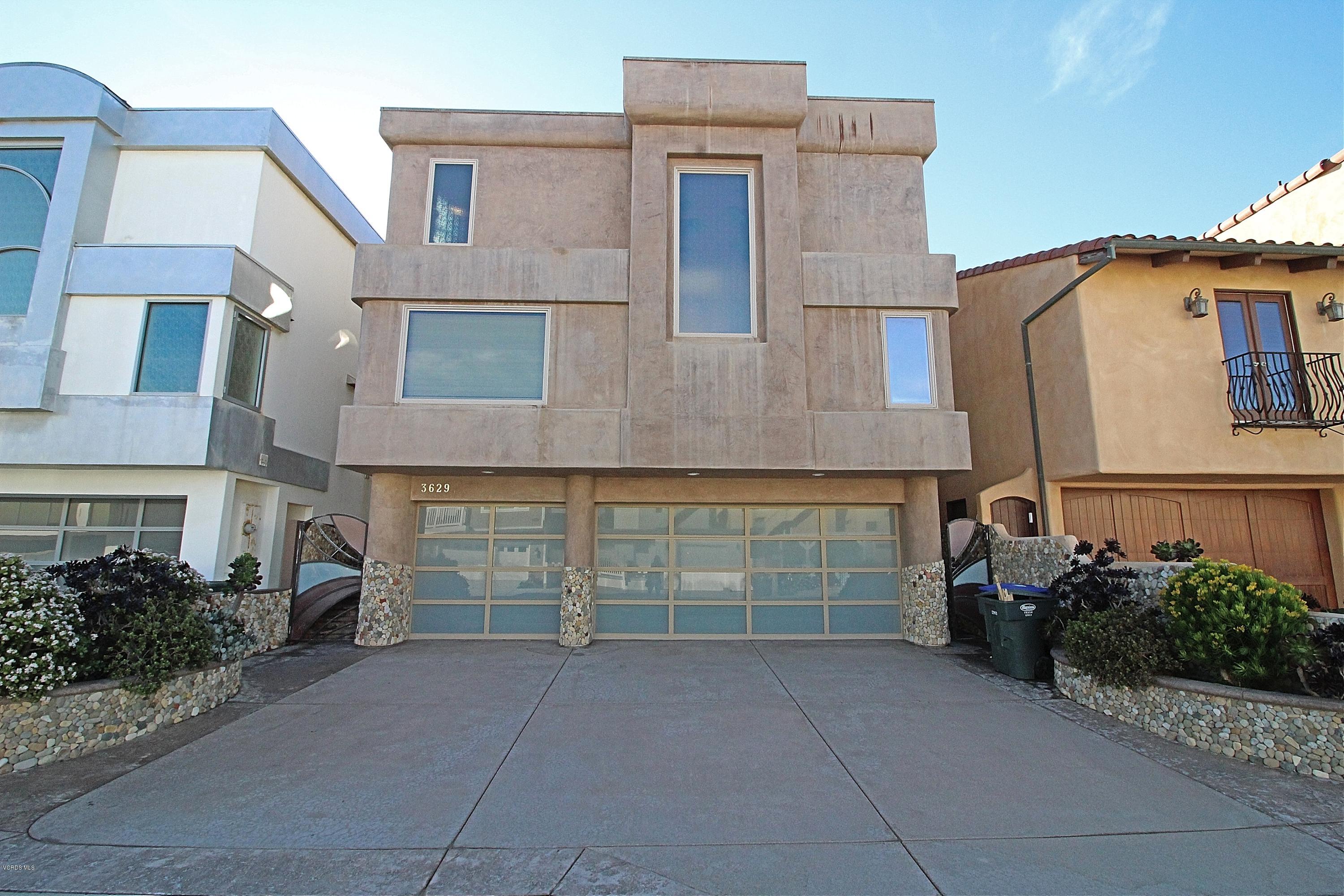 a front view of a house with a garage
