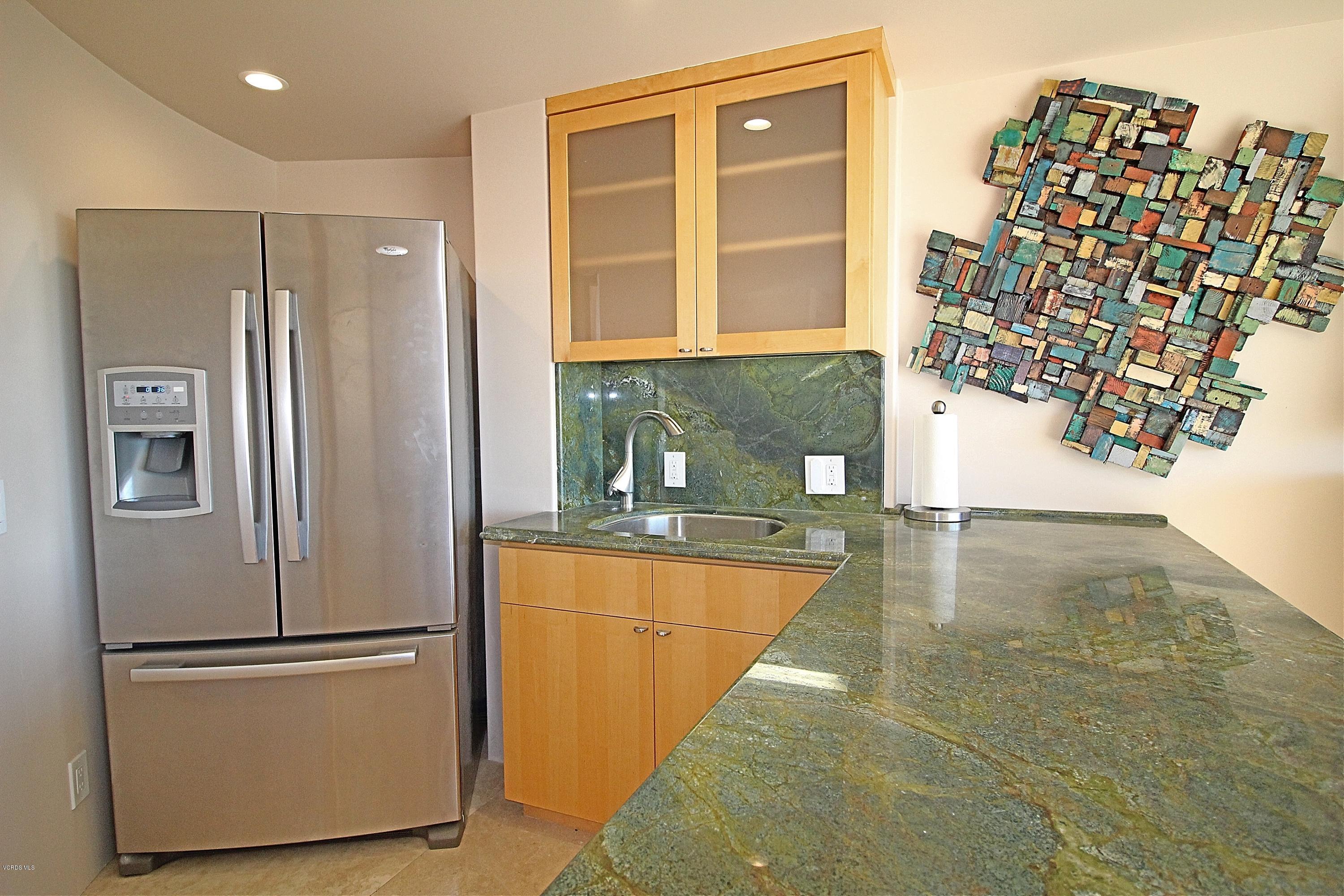 3629 Ocean Drive Oxnard, CA 93035 - Photo 12 of 60 a kitchen with stainless steel appliances granite countertop a refrigerator and a sink
