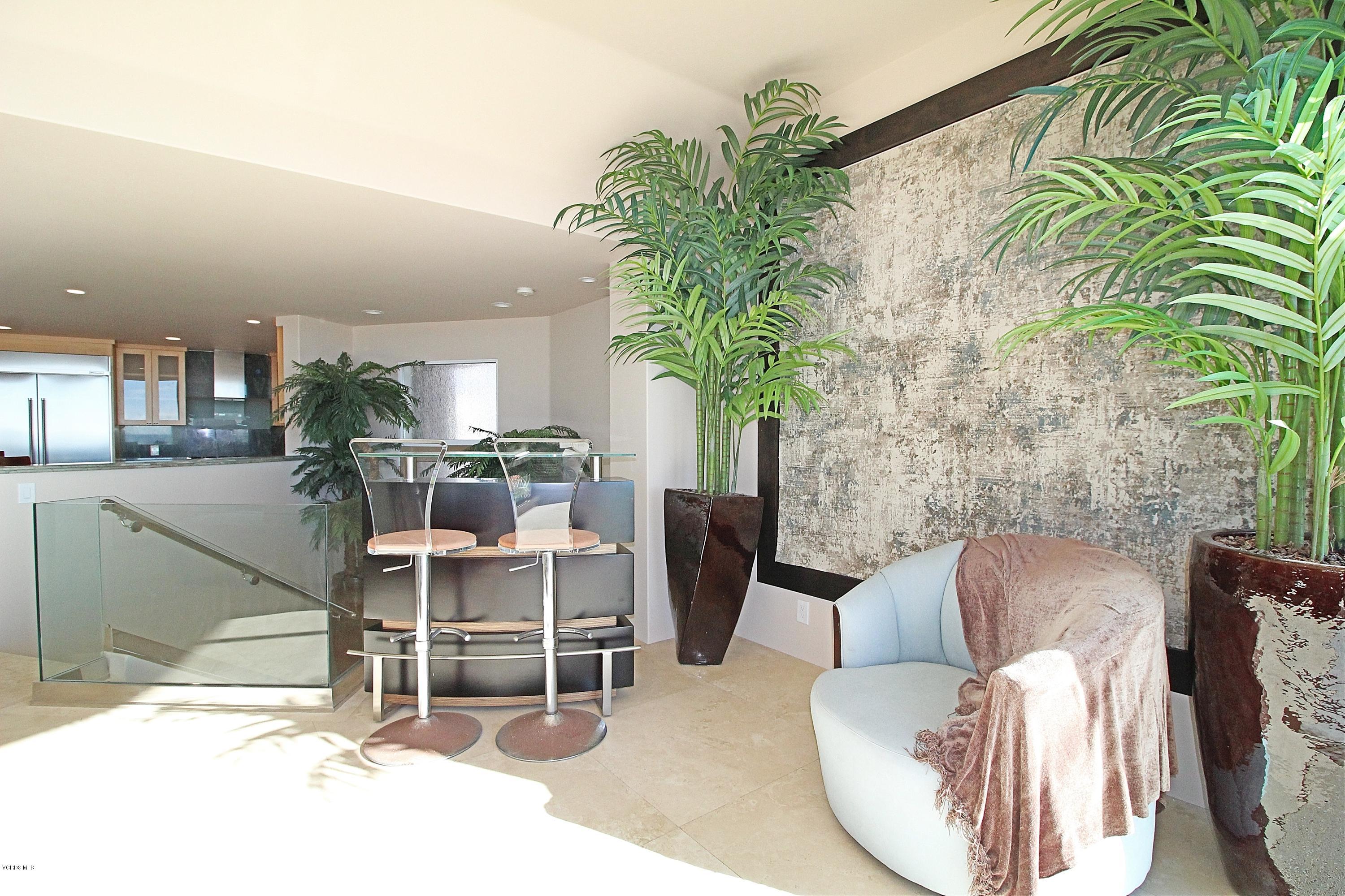 3629 Ocean Drive Oxnard, CA 93035 - Photo 23 of 60 a living room with furniture a potted plant and a kitchen view