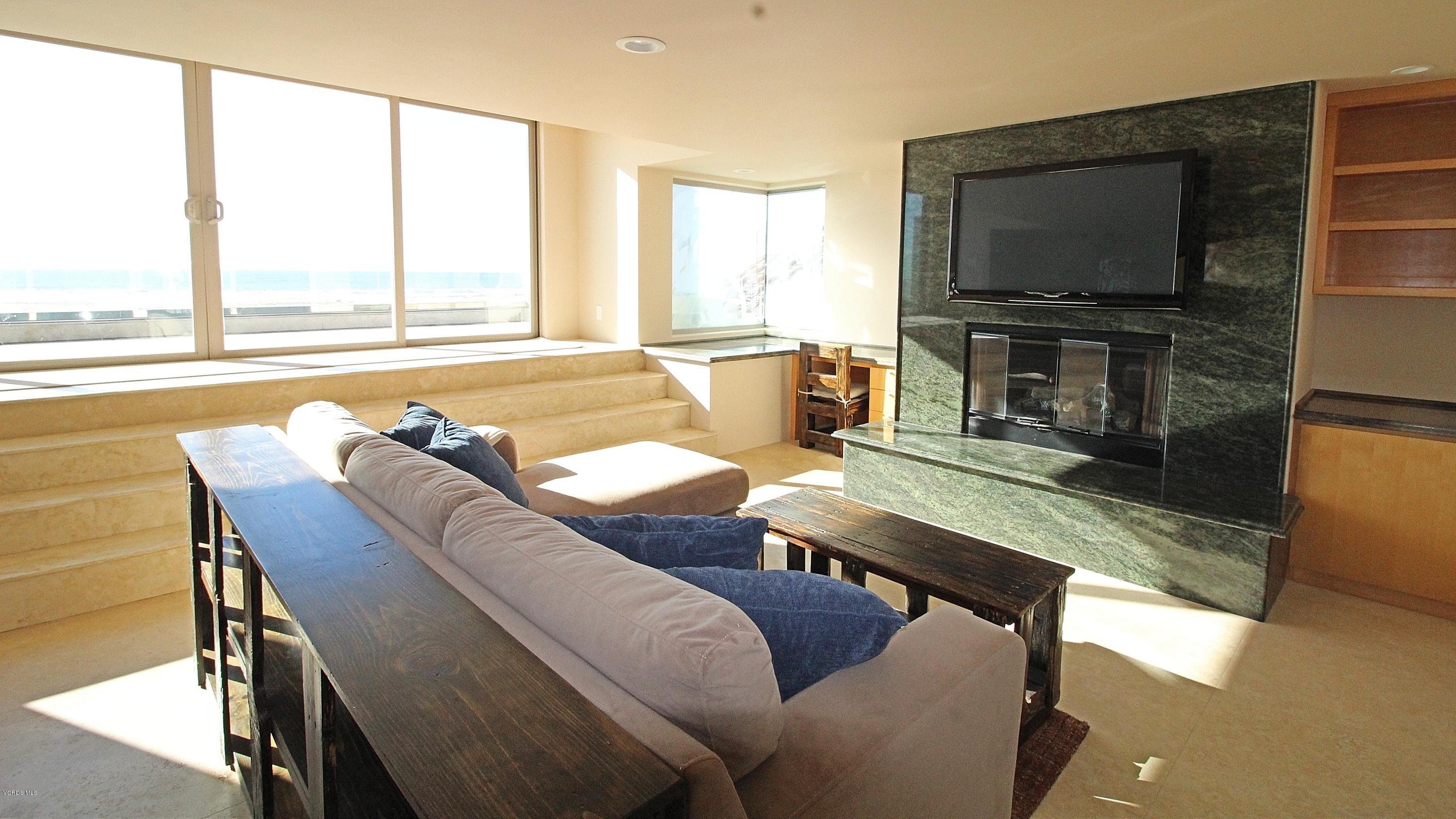 3629 Ocean Drive Oxnard, CA 93035 - Photo 38 of 60 a living room with furniture and a flat screen tv