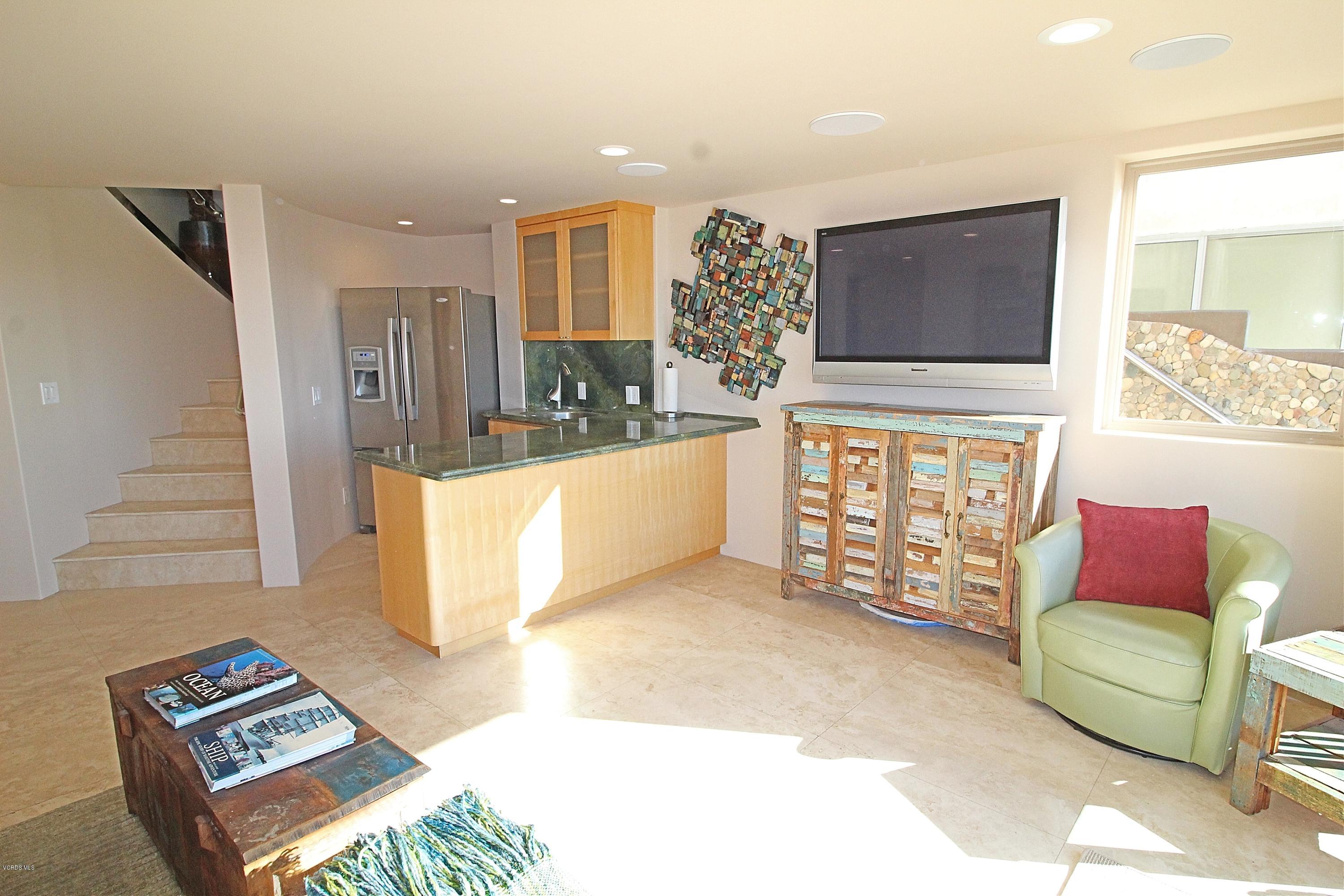 3629 Ocean Drive Oxnard, CA 93035 - Photo 42 of 60 a living room with furniture and a flat screen tv