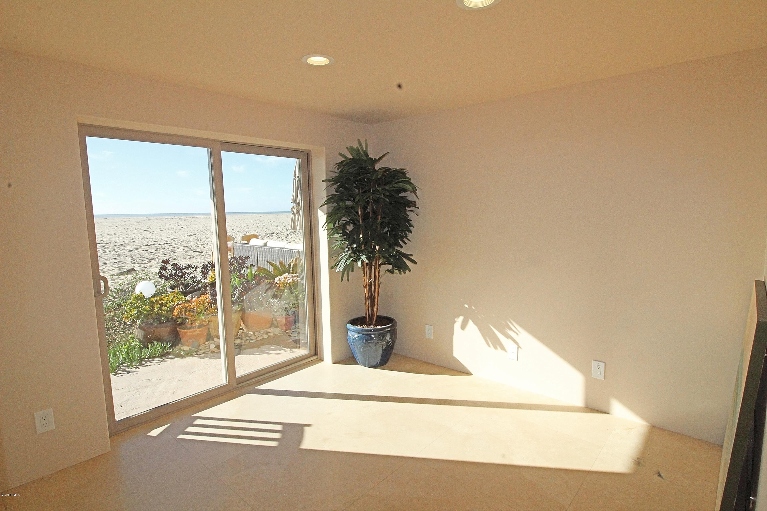 3629 Ocean Drive Oxnard, CA 93035 - Photo 43 of 60 a living room with furniture and a potted plant