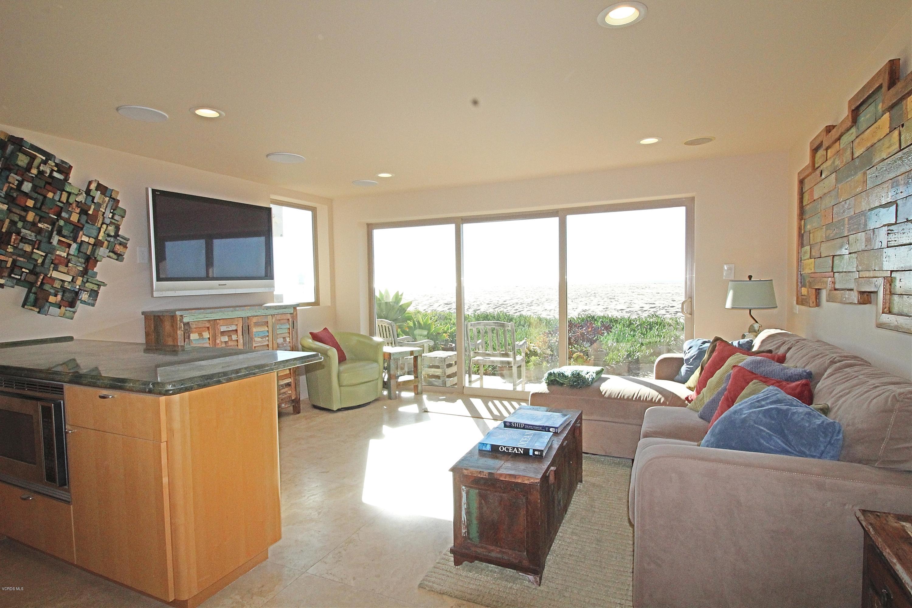 3629 Ocean Drive Oxnard, CA 93035 - Photo 10 of 60 a living room with fireplace furniture and a large window