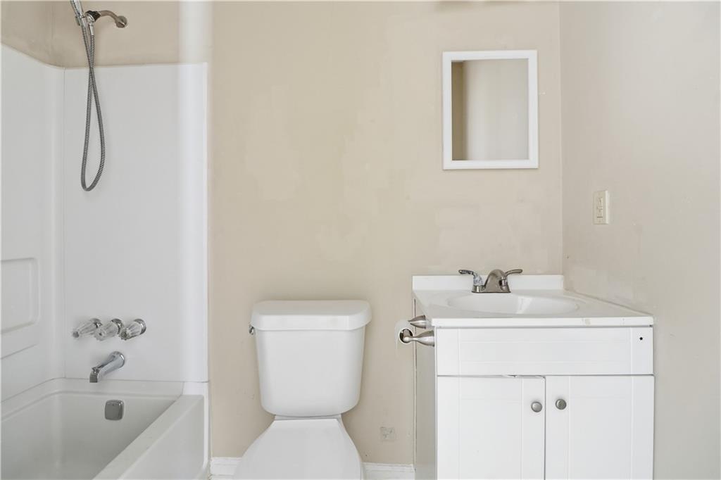 5288 Biffle Downs Road Stone Mountain, GA 30088 - Photo 16 of 18 a bathroom with a sink a toilet and shower