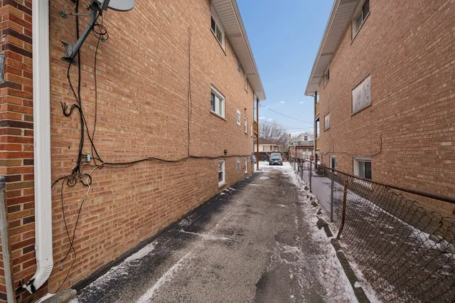 a view of a yard with a snow on the road