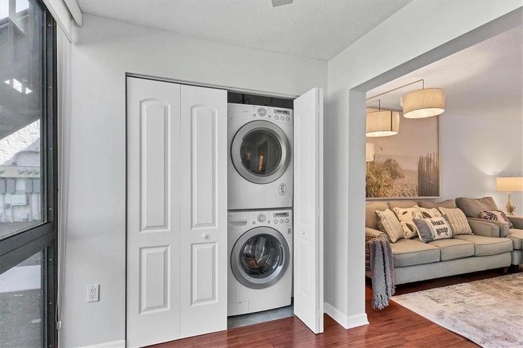 1640 Stickney Point Road, Unit 40101 Sarasota, FL 34231 - Photo 15 of 27 a living room with furniture and a large window
