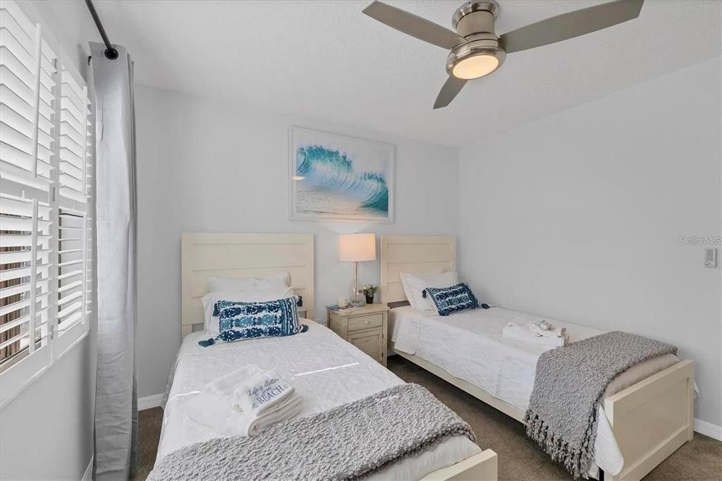 1640 Stickney Point Road, Unit 40101 Sarasota, FL 34231 - Photo 16 of 30 a bedroom with a bed and window