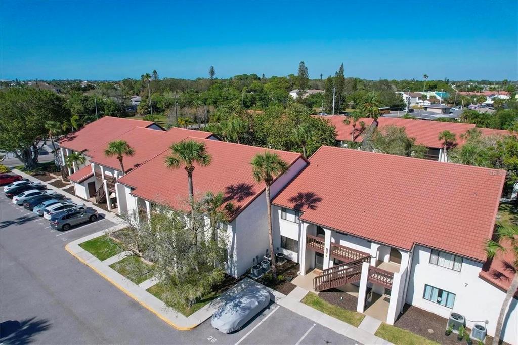 1640 Stickney Point Road, Unit 40101 Sarasota, FL 34231 - Photo 16 of 27 an aerial view of a house with a garden