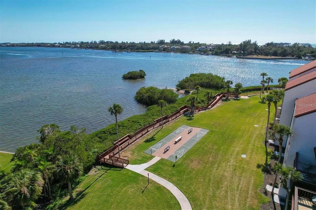 1640 Stickney Point Road, Unit 40101 Sarasota, FL 34231 - Photo 19 of 27 a view of a lake with a city