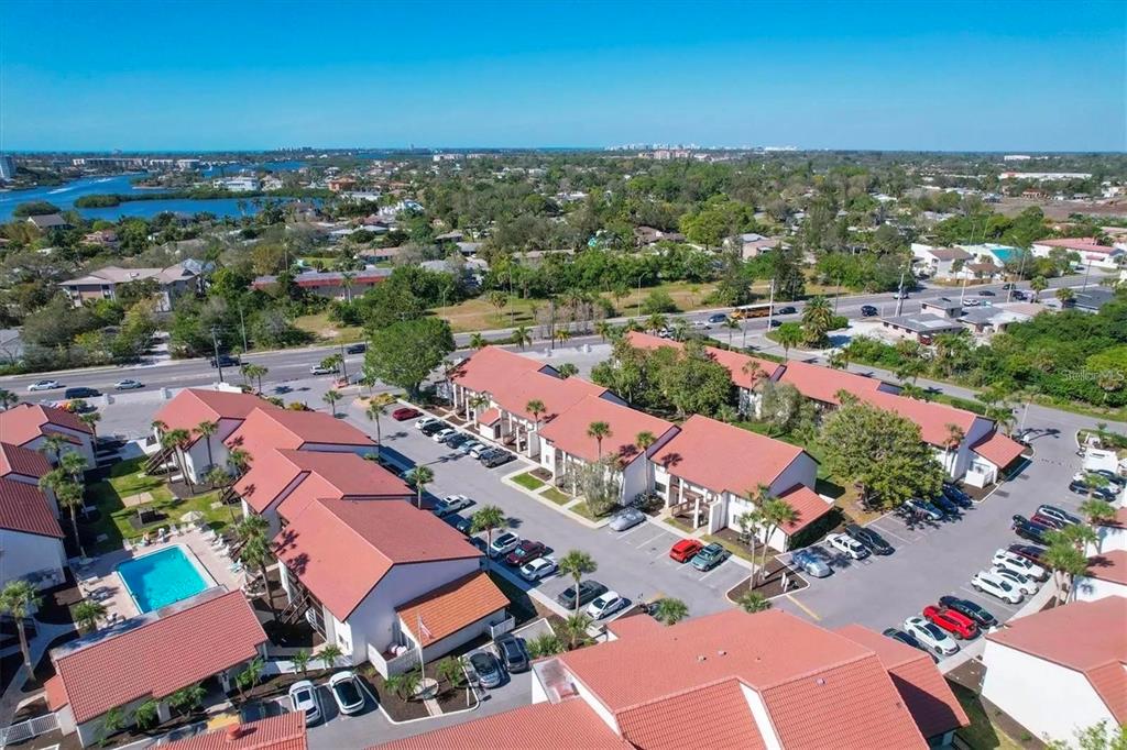1640 Stickney Point Road, Unit 40101 Sarasota, FL 34231 - Photo 20 of 27 an aerial view of residential houses with outdoor space