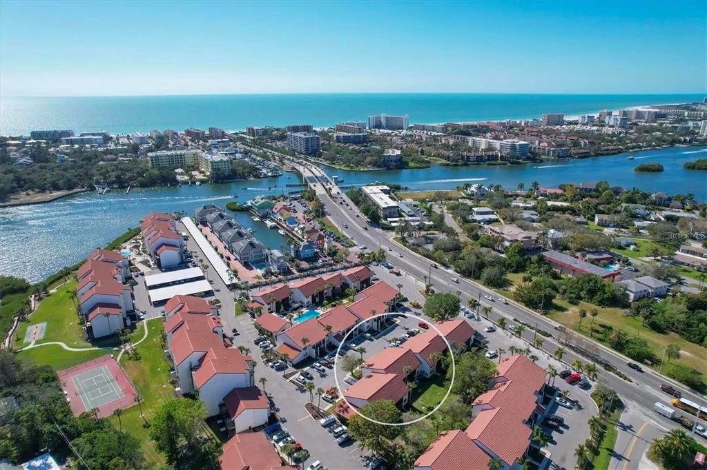 1640 Stickney Point Road, Unit 40101 Sarasota, FL 34231 - Photo 24 of 30 an aerial view of residential building and lake