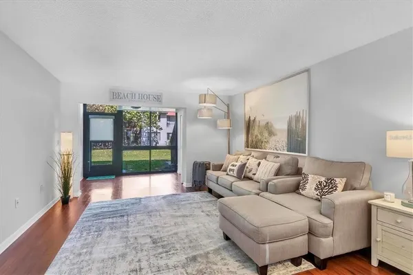 a living room with furniture and a large window