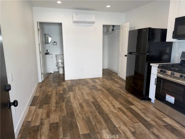 a view of hallway with wooden floor