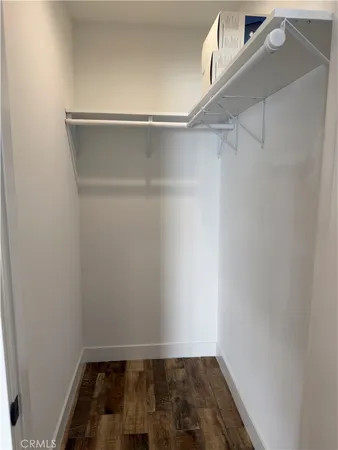 a view of an empty walk in closet