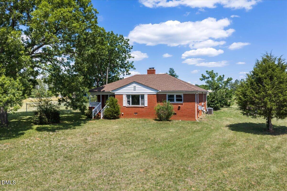 109 Little Ponderosa Road Macon, NC 27551 - Photo 1 of 32 a front view of a house with a yard