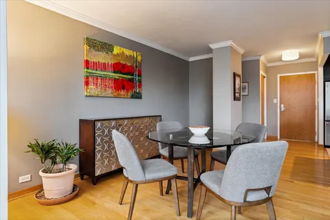 a view of a livingroom with furniture and a potted plant