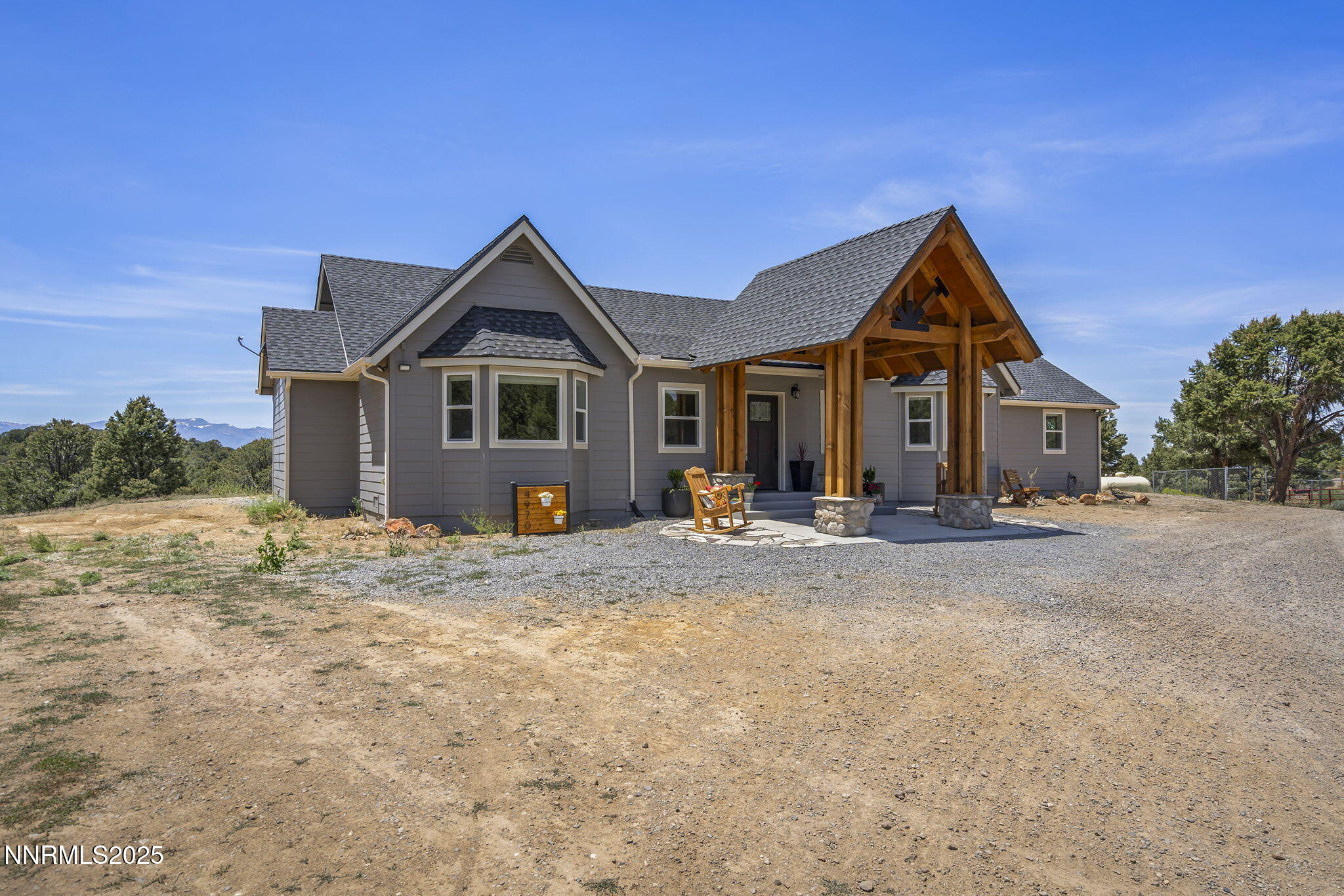 4970 Dry Gulch Road Reno, NV 89521 - Photo 11 of 44 a front view of a house with a yard