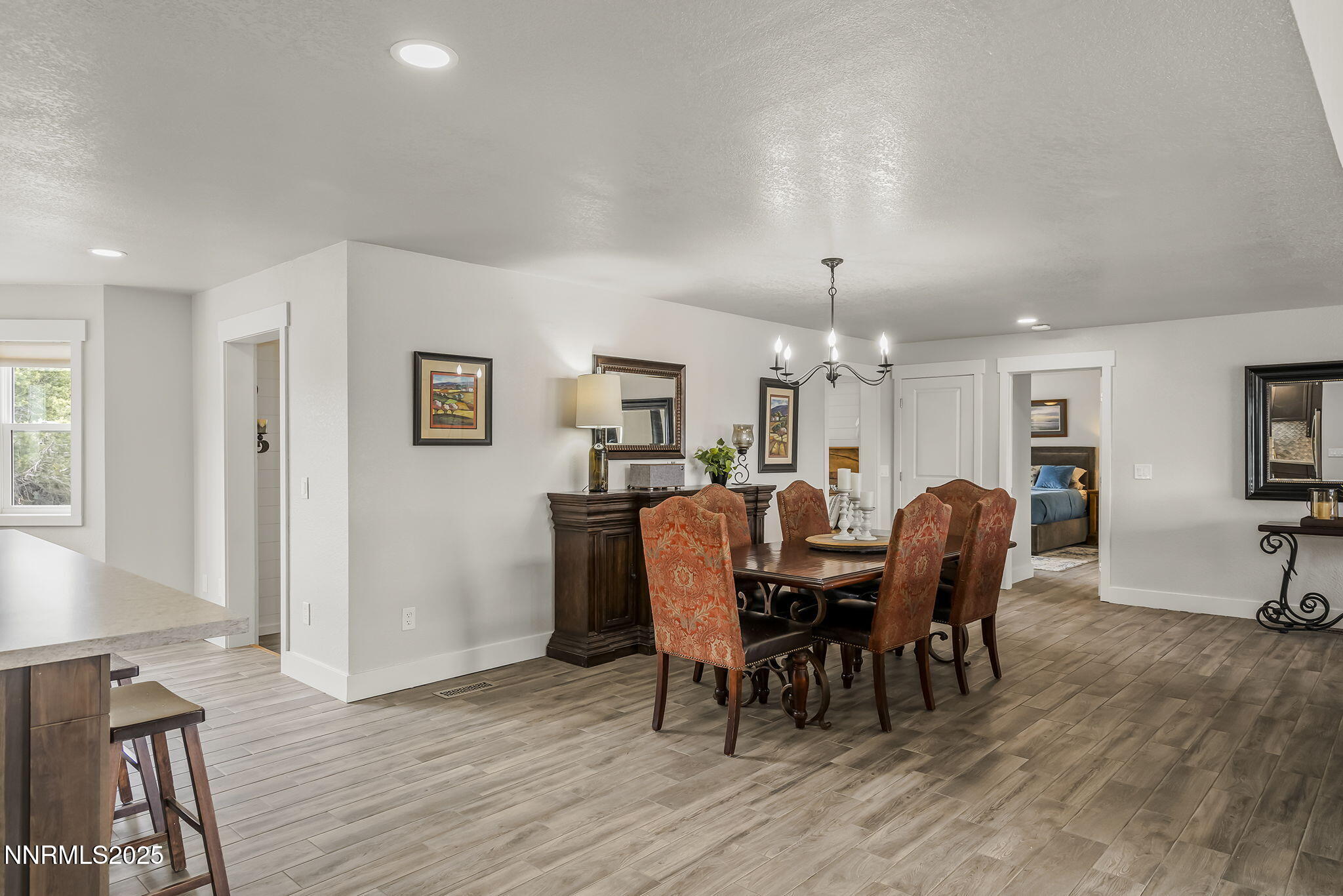 4970 Dry Gulch Road Reno, NV 89521 - Photo 20 of 44 a view of a dining room with furniture window and wooden floor