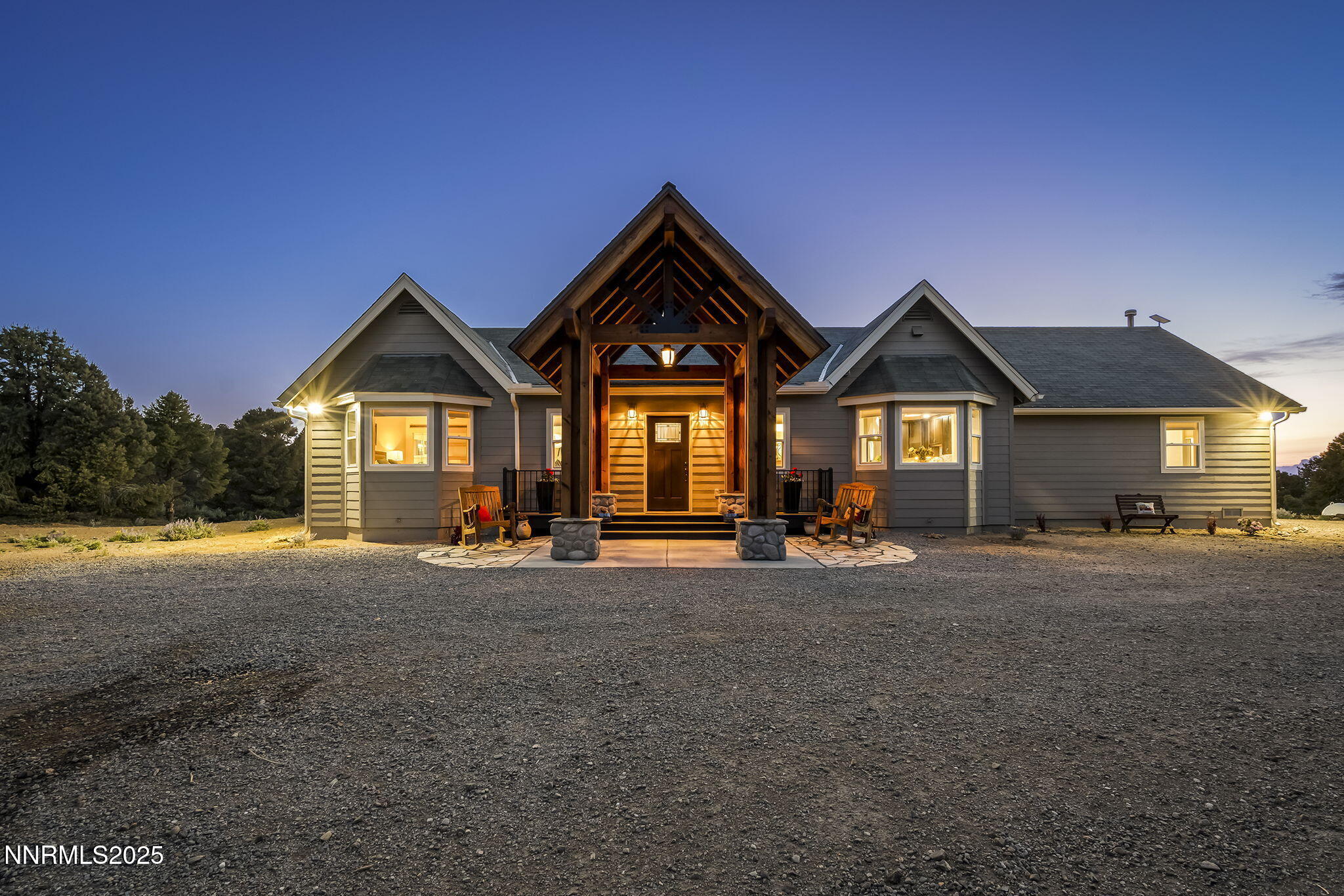 4970 Dry Gulch Road Reno, NV 89521 - Photo 2 of 44 a view of a house with a yard and garage