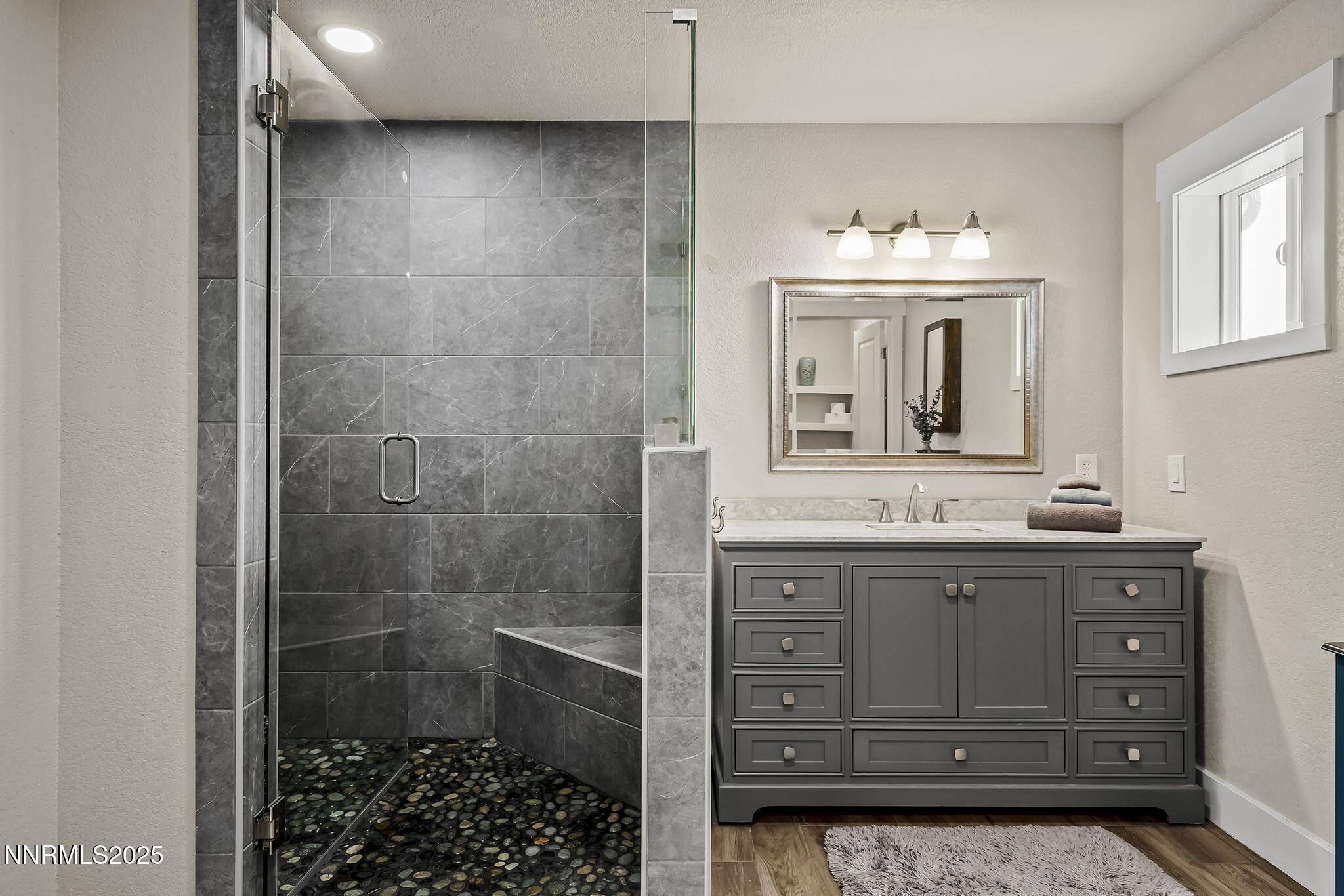 4970 Dry Gulch Road Reno, NV 89521 - Photo 26 of 44 a bathroom with a sink a vanity and a mirror