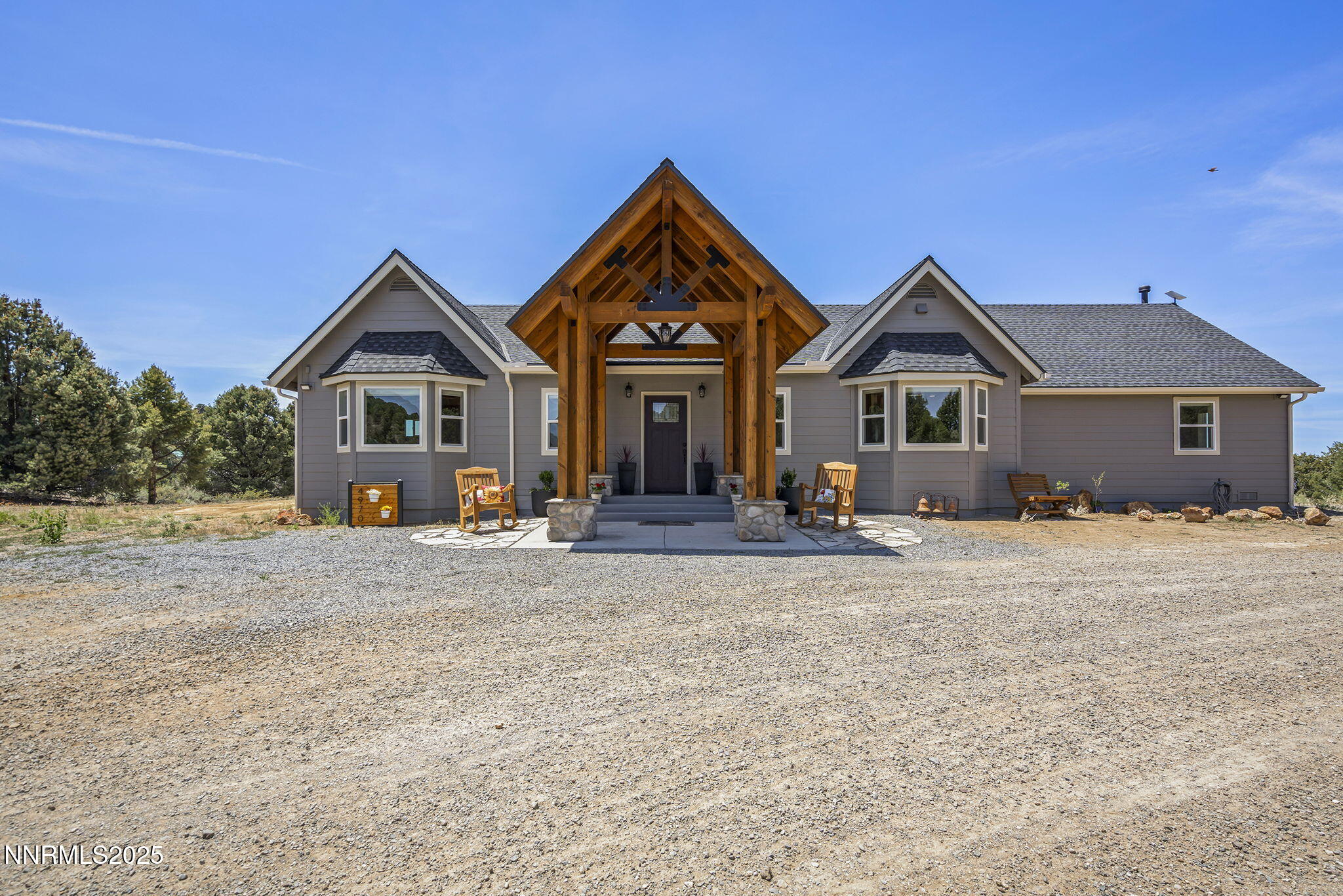 4970 Dry Gulch Road Reno, NV 89521 - Photo 10 of 44 a front view of a house with a yard