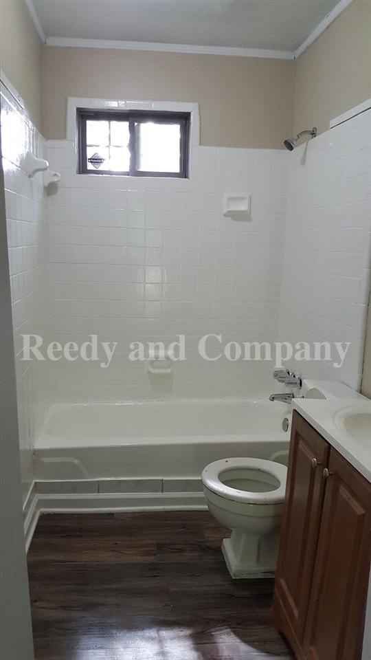 3947 McCain Road Memphis, TN 38109 - Photo 14 of 17 a bathroom with a toilet and a sink