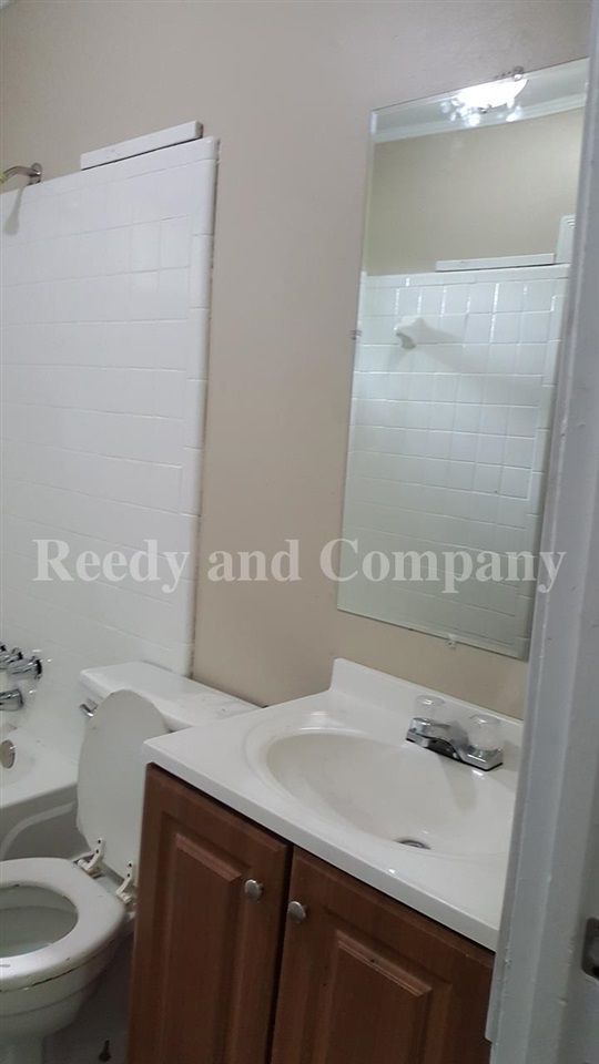 3947 McCain Road Memphis, TN 38109 - Photo 15 of 17 a bathroom with a sink and a mirror