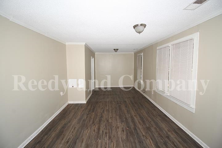 3947 McCain Road Memphis, TN 38109 - Photo 4 of 17 a view of empty room with wooden floor