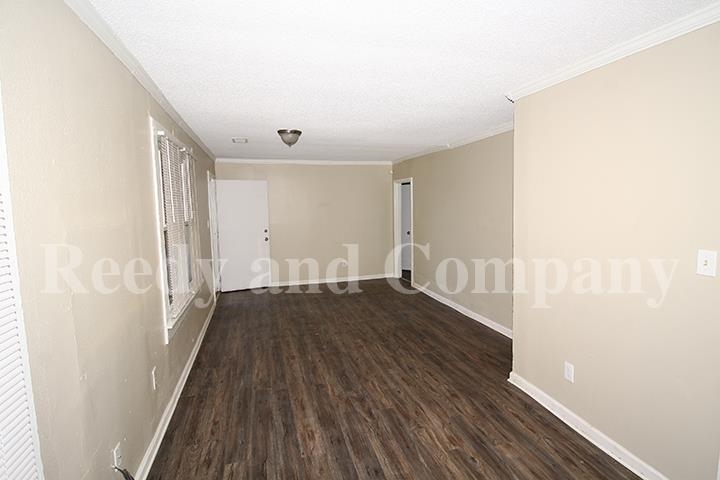 3947 McCain Road Memphis, TN 38109 - Photo 5 of 17 a view of a hallway with wooden floor