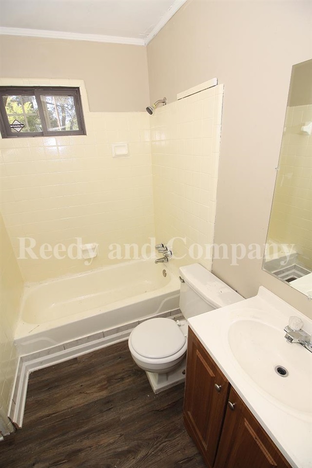 3947 McCain Road Memphis, TN 38109 - Photo 10 of 17 a bathroom with a sink a toilet and shower