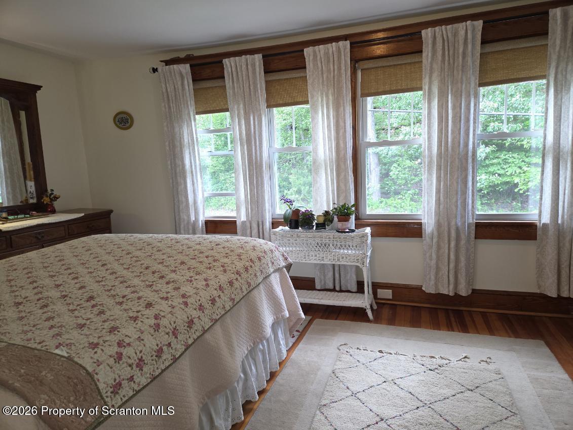 229 East Mountain Road Scranton, PA 18505 - Photo 26 of 47 a bed sitting in a bedroom next to a window