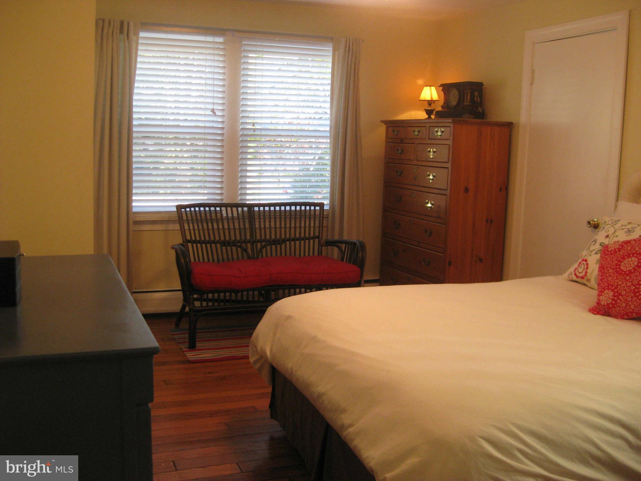 420 Cedar Grove Road Edgewater, MD 21037 - Photo 14 of 27 a bedroom with a bed and wooden floor
