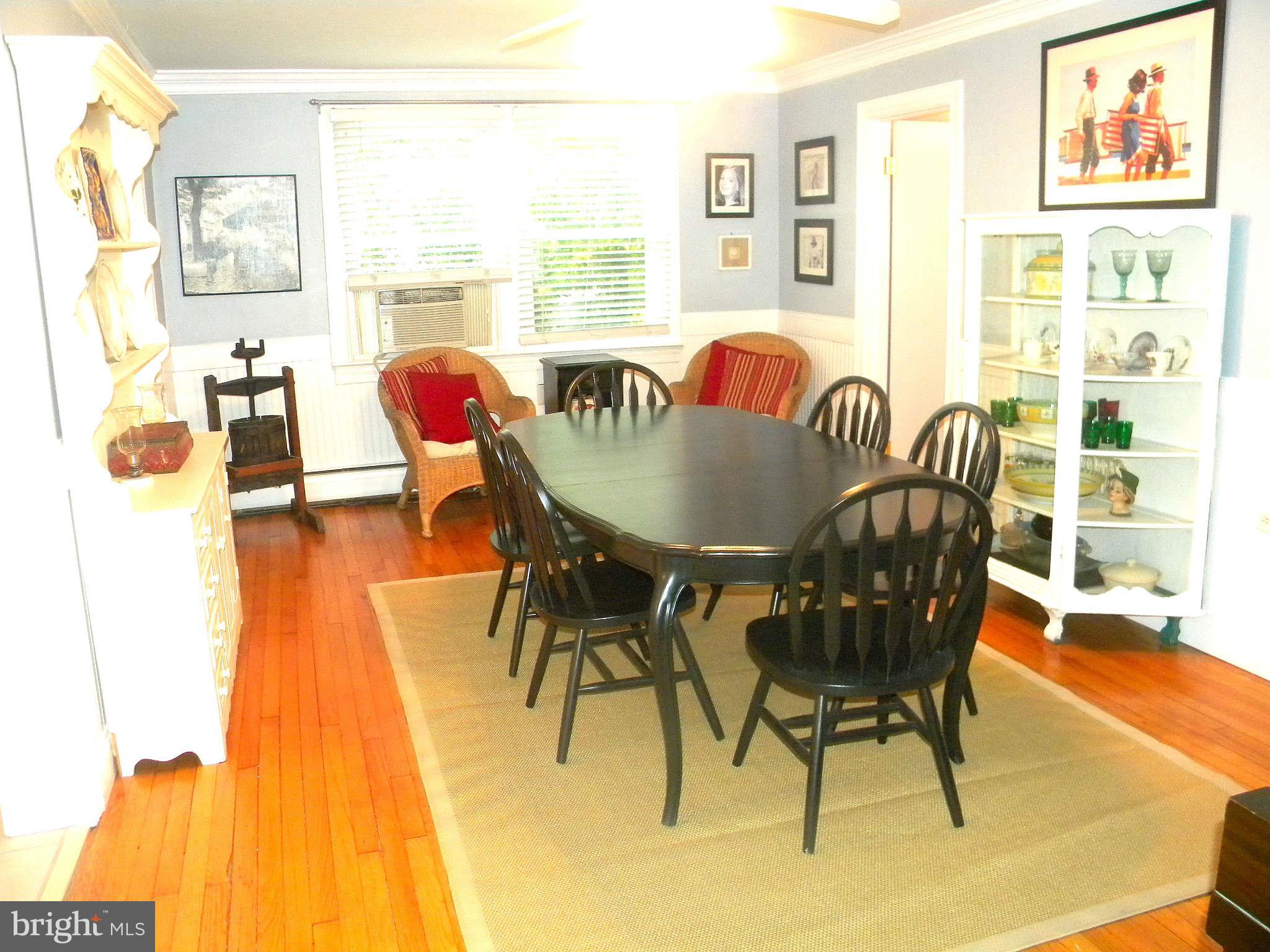 420 Cedar Grove Road Edgewater, MD 21037 - Photo 8 of 27 a dining room with furniture and wooden floor