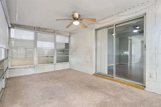 a view of an empty room with a glass door