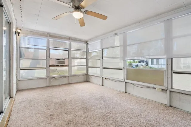 a view of an empty room with a cabinet
