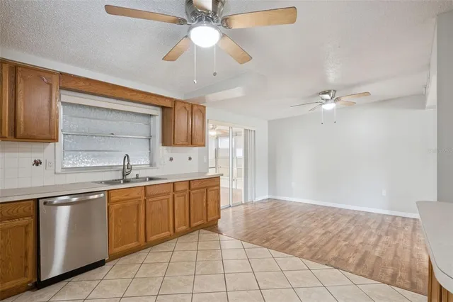 a spacious bathroom with a sink a mirror and a bathtub