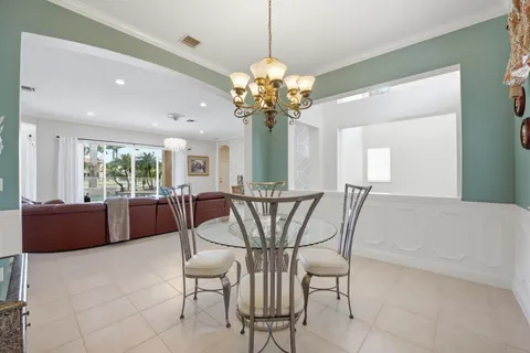 a large kitchen with stainless steel appliances granite countertop a stove and a sink